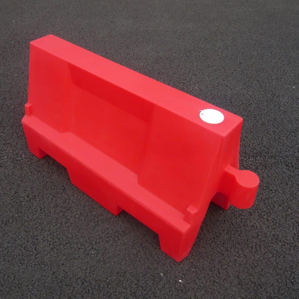 red barrier on tarmac