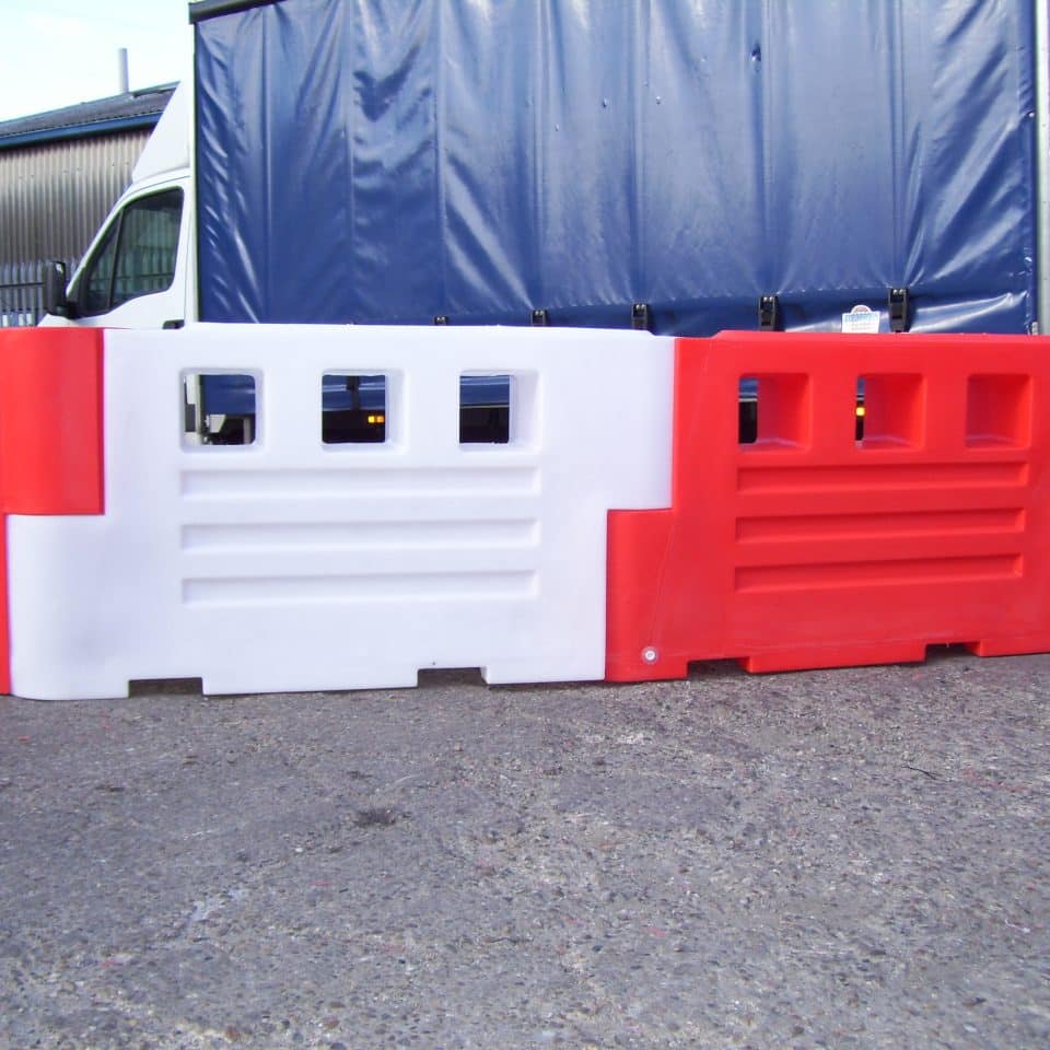 red and white barriers in front of van