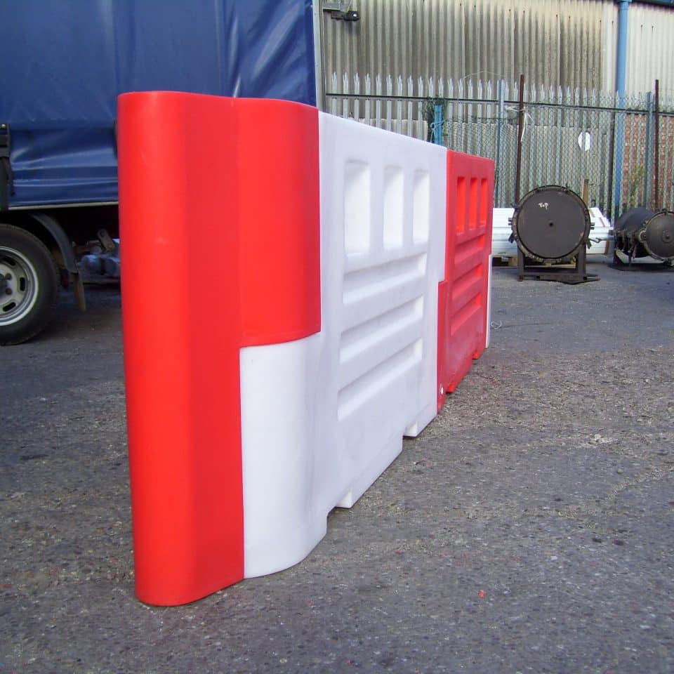 red and white barriers side other side on