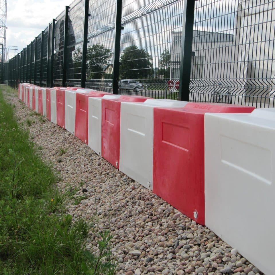 red and white starting grid barrier front on