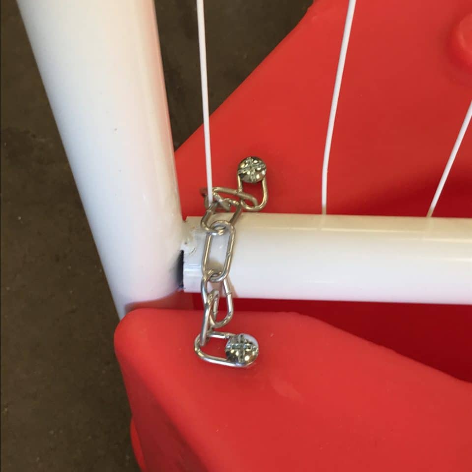 mini chain in white fence