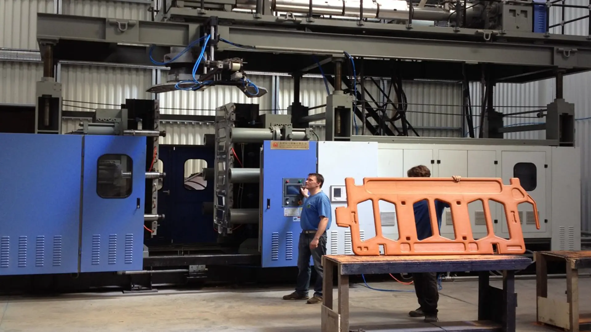 One of our workers with an orange barrier