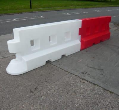 Red barrier on the street side by side