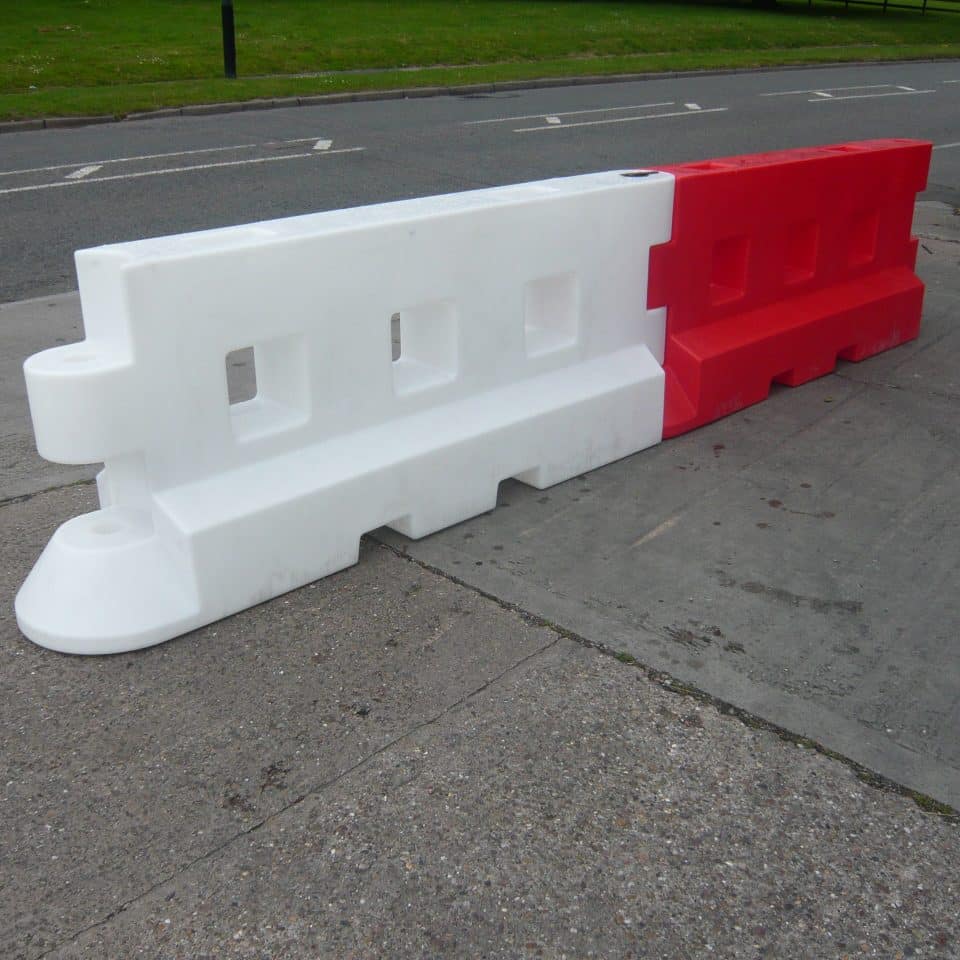 Red barrier on the street side by side
