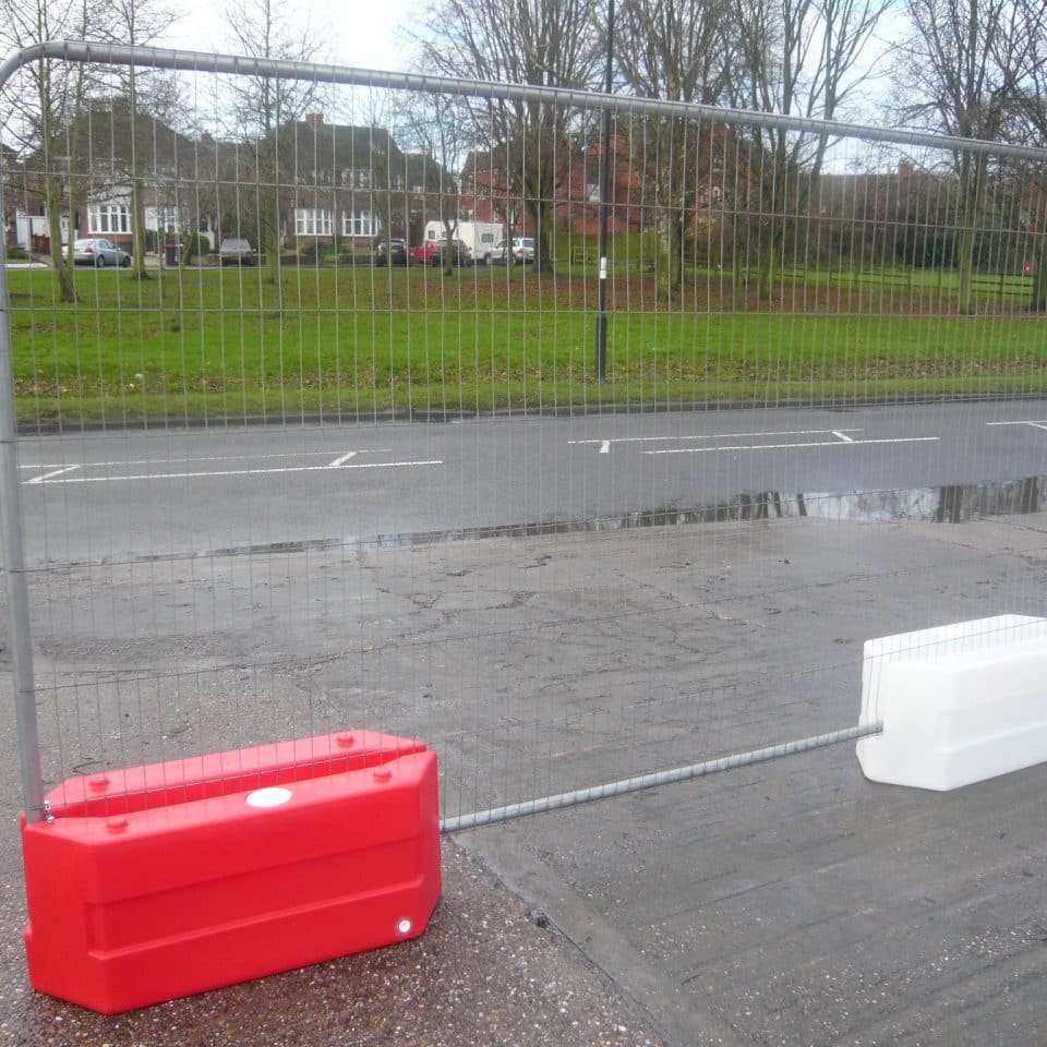 silver fence in red and white blocks