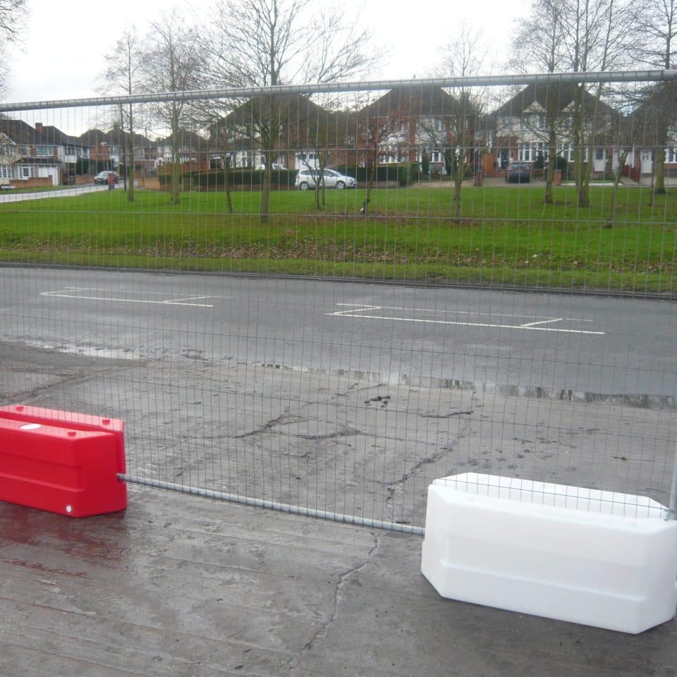 silver fence in red and white blocks